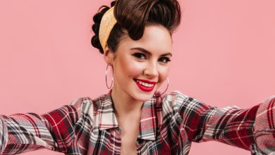 lovely young woman checkered shirt smiling pink background emotional pinup girl taking selfie 197531 13283